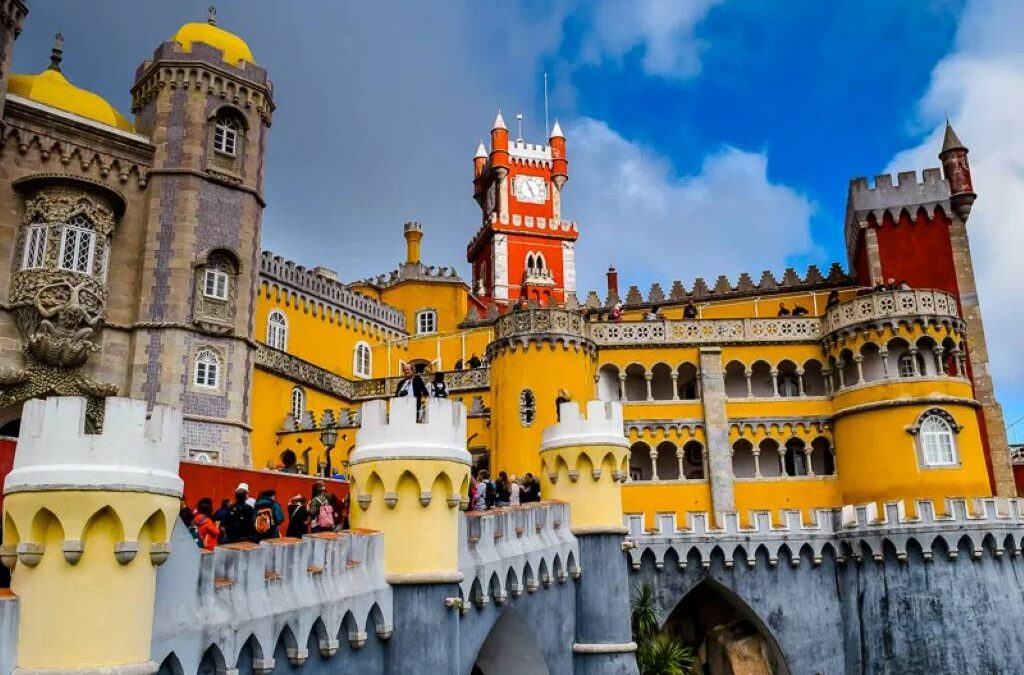 Family laughing at Pena Palace colorful towers in Sintra Portugal