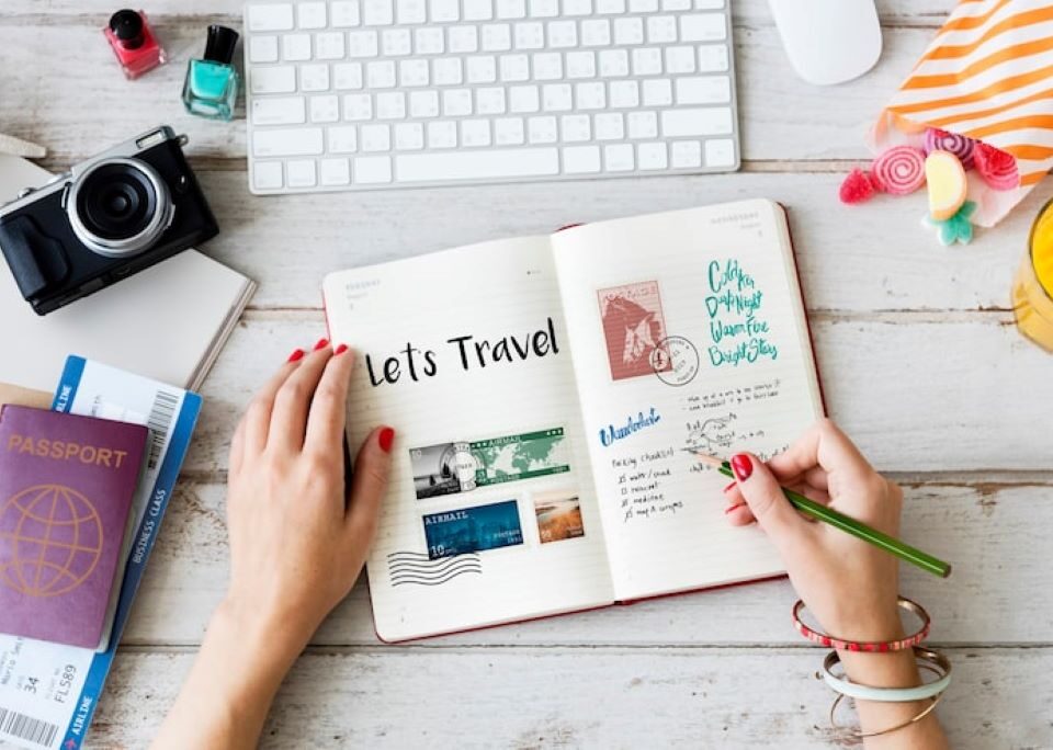 Person editing travel videos and organizing digital memories on a laptop